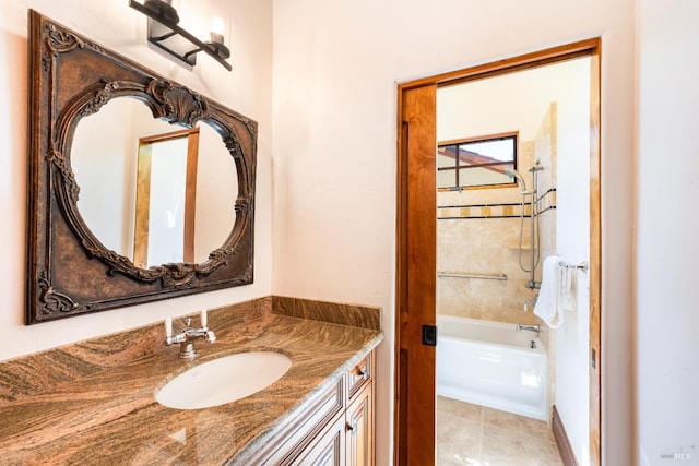 bathroom with vanity and tiled shower / bath