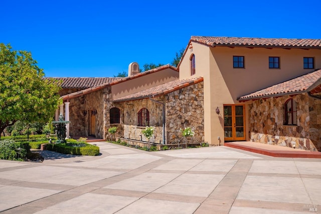 mediterranean / spanish-style house featuring a patio