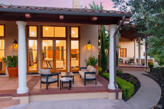 view of patio terrace at dusk