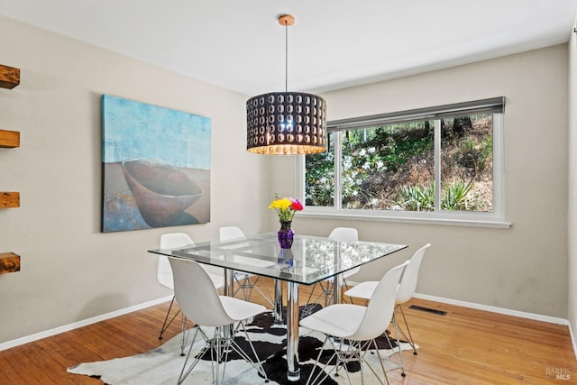 dining room with light wood-type flooring