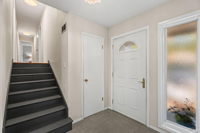 foyer entrance featuring tile patterned floors