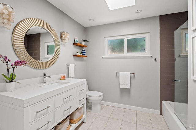 full bathroom featuring toilet, a skylight, tiled shower / bath combo, tile patterned flooring, and vanity