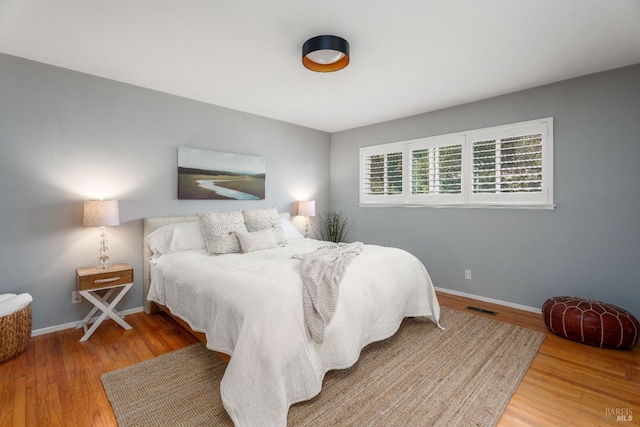 bedroom with wood-type flooring