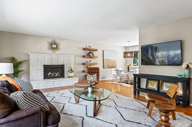 living room with a fireplace and light hardwood / wood-style floors