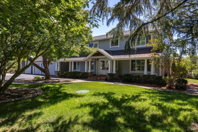 view of front facade featuring a garage and a front yard