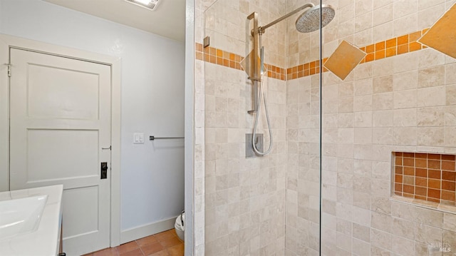 bathroom featuring tile patterned floors, tiled shower, and toilet