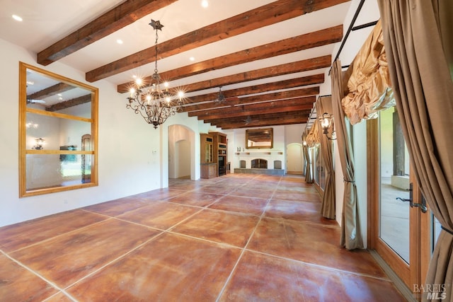 interior space featuring tile patterned flooring, beam ceiling, and a chandelier