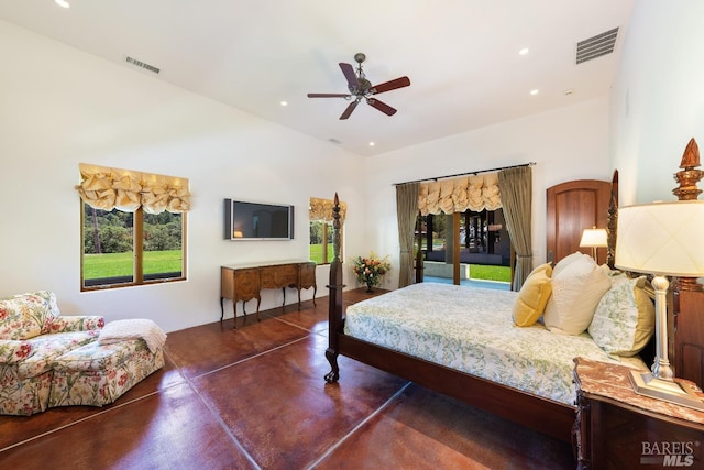 bedroom featuring access to exterior, concrete floors, ceiling fan, and multiple windows