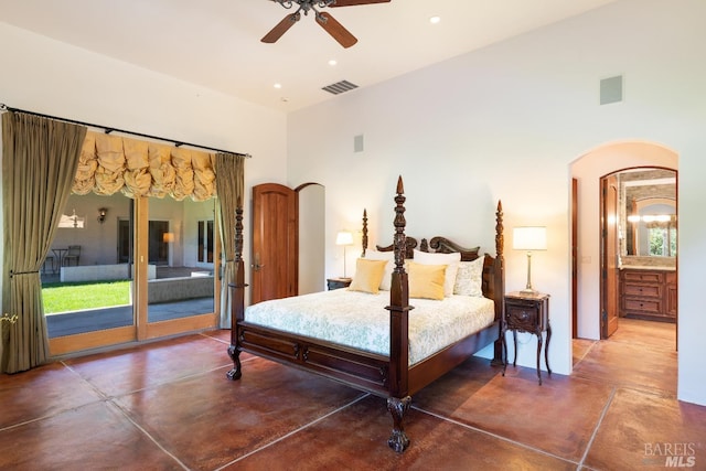 bedroom with a high ceiling, ceiling fan, concrete floors, and access to exterior