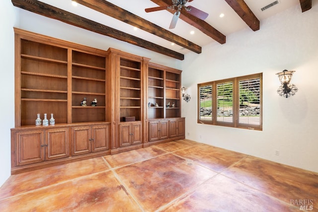 interior space with ceiling fan, beamed ceiling, and built in shelves