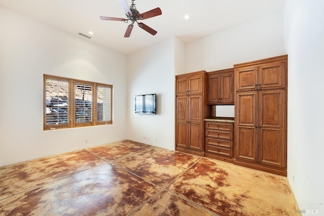 unfurnished living room featuring ceiling fan