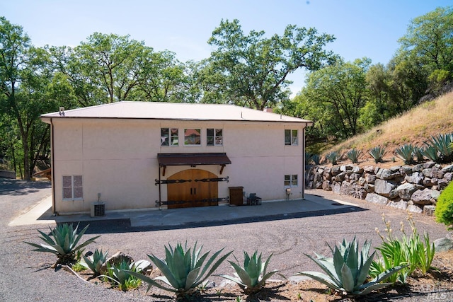 rear view of house featuring a patio area