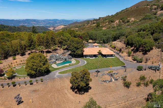 birds eye view of property with a mountain view