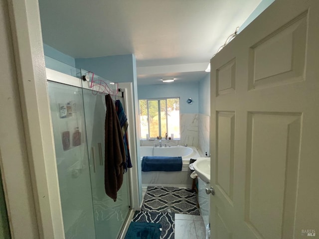 full bathroom with a garden tub and a shower stall