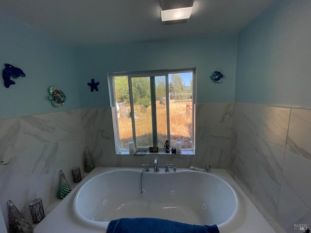 full bathroom featuring a jetted tub