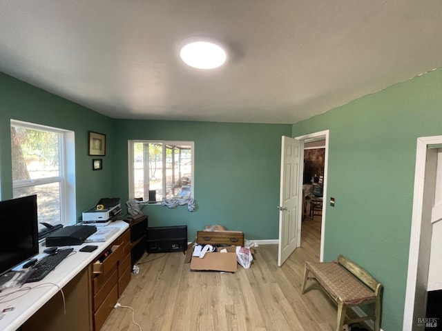 home office featuring light wood-style floors and baseboards