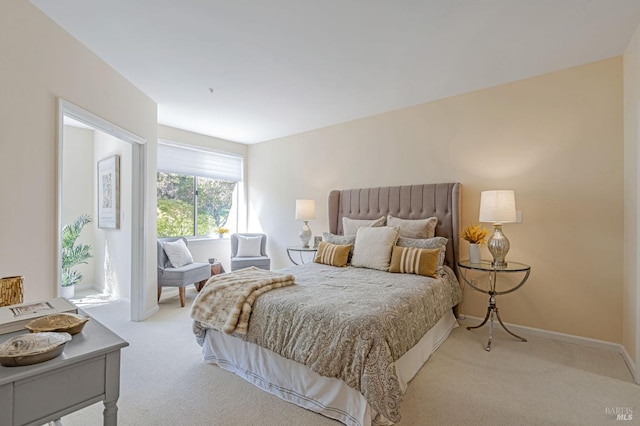 carpeted bedroom with baseboards
