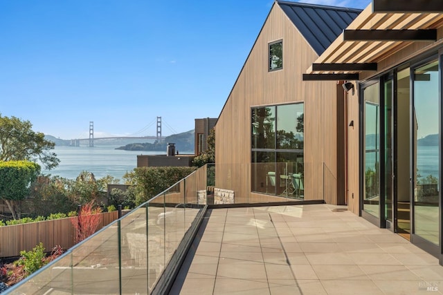 balcony featuring a water view