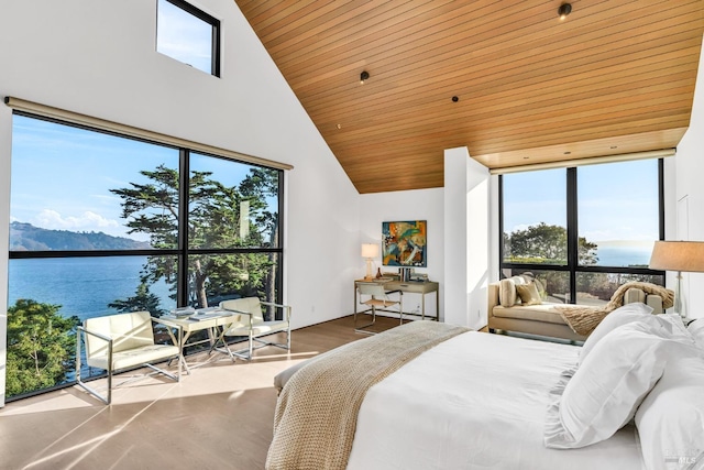 bedroom with a water and mountain view, wood-type flooring, wood ceiling, and a towering ceiling