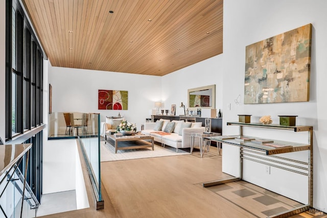 living room with hardwood / wood-style floors and wood ceiling