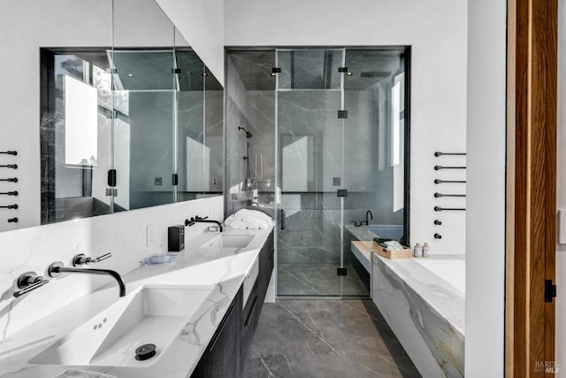 bathroom with vanity and independent shower and bath