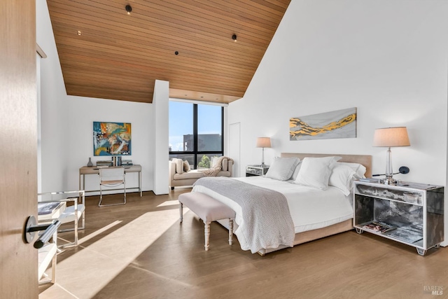 bedroom with wood ceiling, wood-type flooring, and high vaulted ceiling