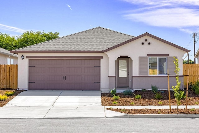 view of front facade featuring a garage, roof with shingles, stucco siding, and fence