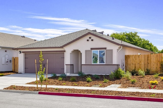 view of front of house featuring stucco siding, driveway, an attached garage, fence, and a shingled roof