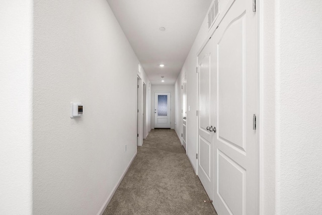 corridor with recessed lighting, carpet, visible vents, and baseboards