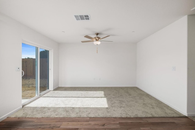 6509 Jackpot Pl, Riverbank, CA 95367 - unfurnished room featuring a ceiling fan, baseboards, wood finished floors, and carpet