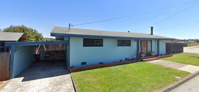 view of front of property with a carport and a front lawn