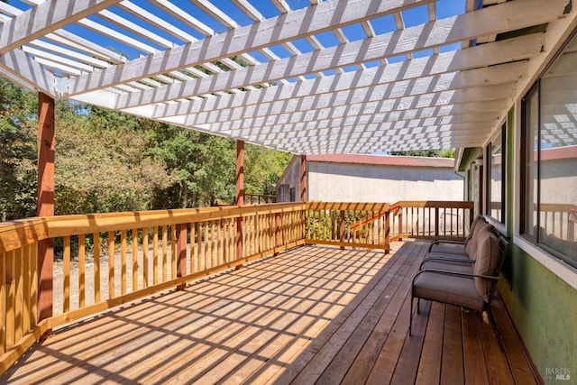 wooden deck featuring a pergola