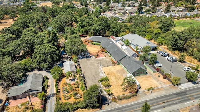 birds eye view of property with a residential view