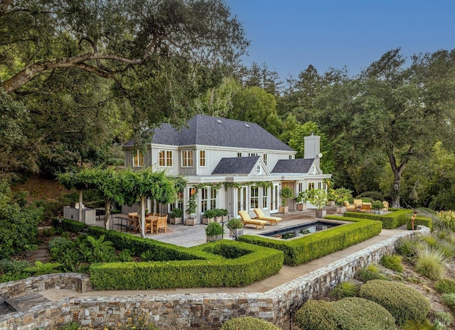 back of property featuring a patio area