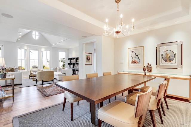 dining room with an inviting chandelier and hardwood / wood-style floors