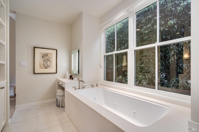 bathroom featuring a bath, vanity, and tile patterned floors