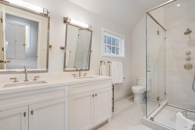 bathroom with vaulted ceiling, vanity, an enclosed shower, toilet, and tile patterned floors