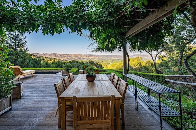 view of patio / terrace with a deck with mountain view