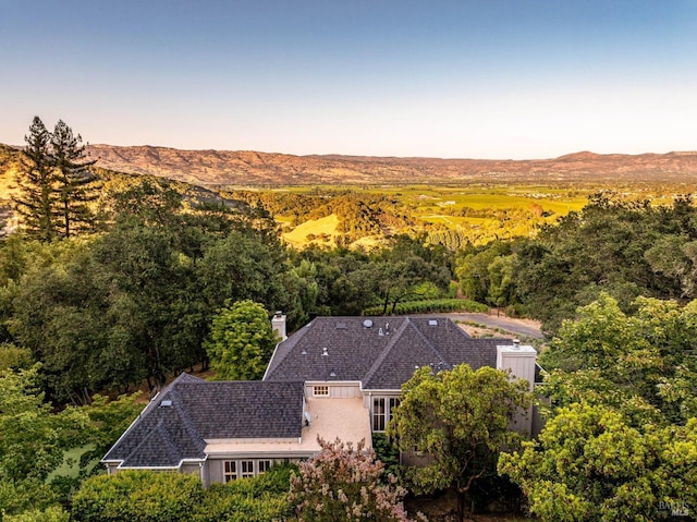 aerial view at dusk with a mountain view