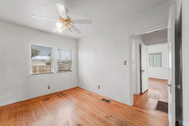 unfurnished room with hardwood / wood-style floors and ceiling fan