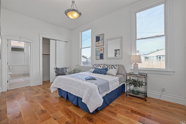 bedroom featuring a closet and wood-type flooring