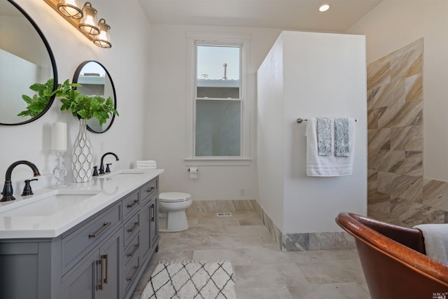 bathroom with vanity and toilet