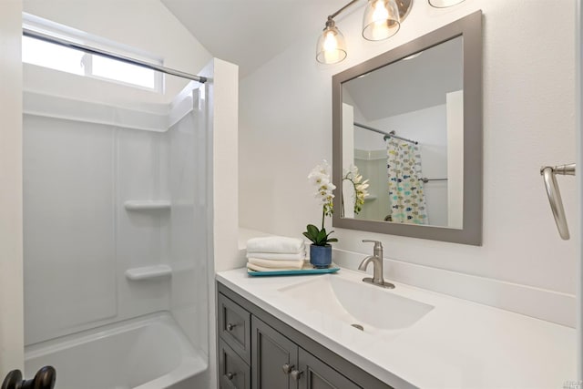 bathroom featuring vanity and shower / bath combination with curtain