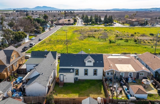 birds eye view of property featuring a mountain view