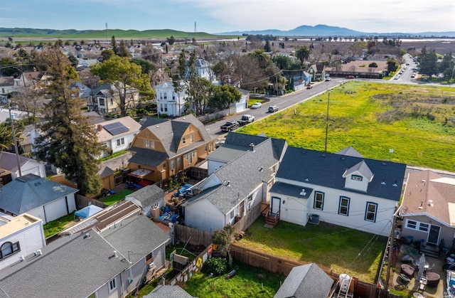 birds eye view of property with a mountain view