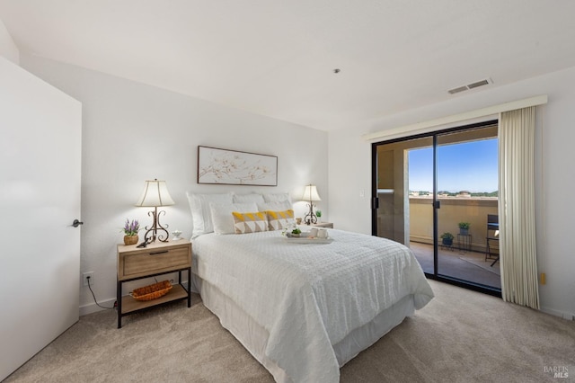 carpeted bedroom featuring access to outside