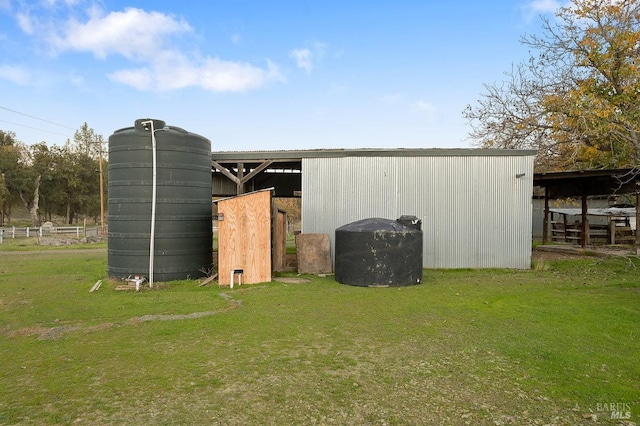 view of outdoor structure featuring a lawn