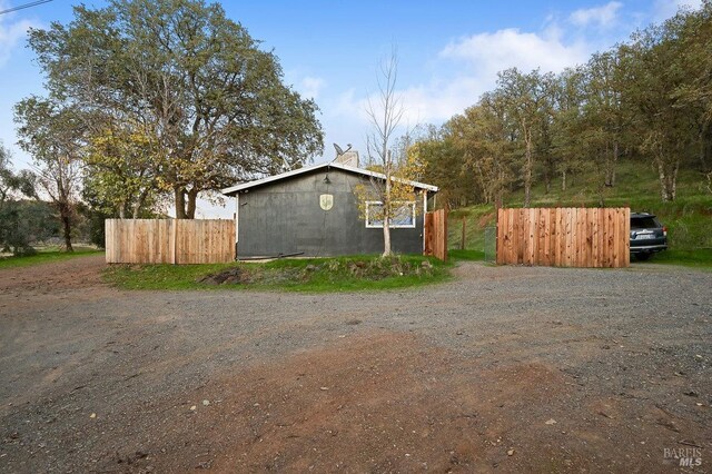 view of side of home with an outdoor structure