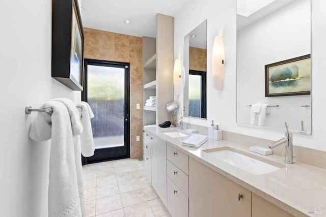 bathroom featuring tile patterned flooring and vanity