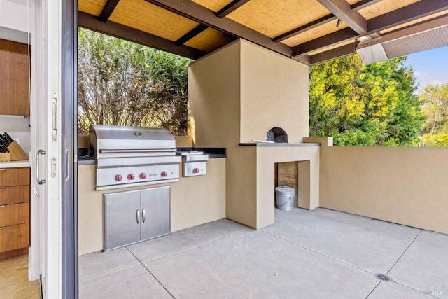 view of patio featuring exterior kitchen and grilling area